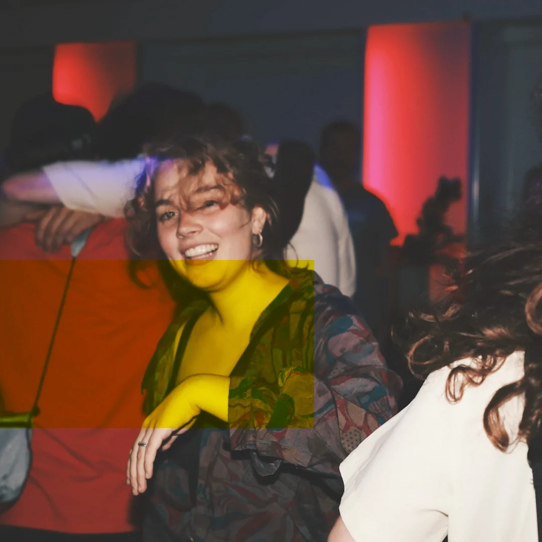 Editing Room: a woman laughing on the dance floor, a yellow field across her hand