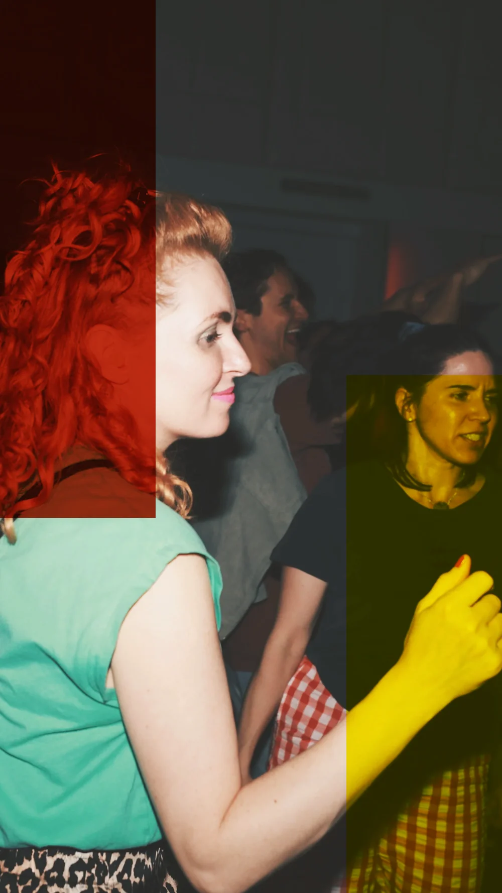 A woman with red curls dancing in the crowd