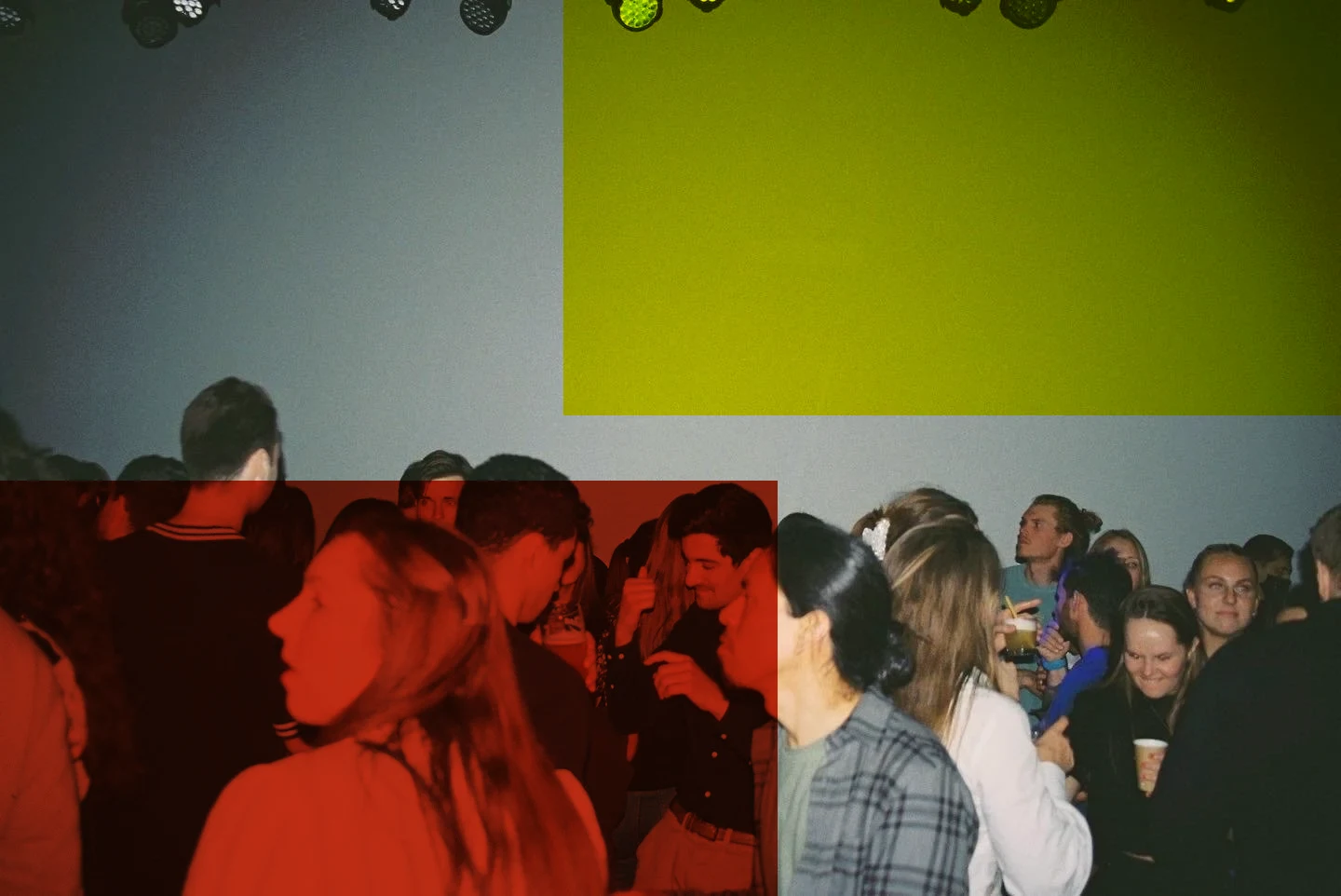 The crowd in the room, lights hanging from the ceiling