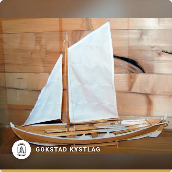Gokstad Kystlag: a model of a wooden sailing boat on a workbench